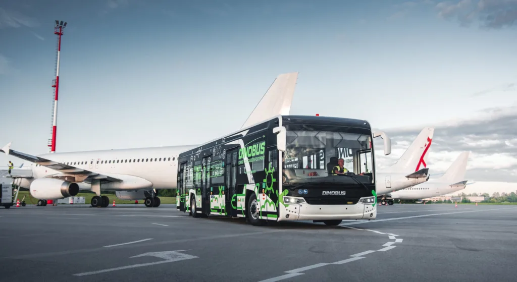 Apron bus in operation alongside parked aircraft